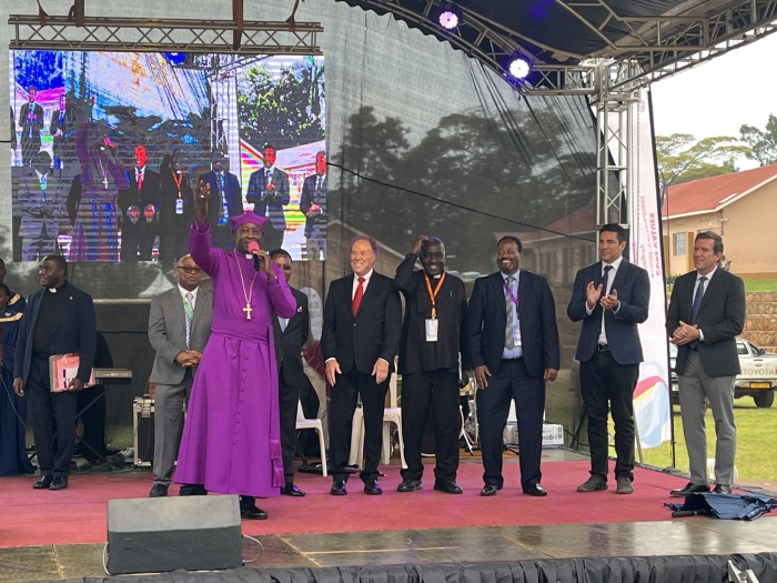 Jerry Rueb (in red tie), lead pastor of Cornerstone Church in Long Beach, Calif., and chairman of the Church Transformation Network attends a graduation ceremony for 7,000 clergy of the Church of Uganda with Archbishop Stephen Kazimba on August 18, 2025.