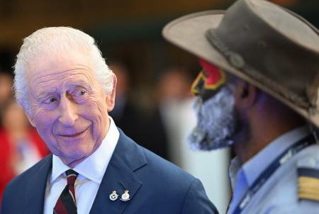 King Charles III talks with Pilot Joseph Tua in the hanger at RAF Northolt as he celebrates the 80th anniversary of Mission Aviation Fellowship (MAF) the humanitarian air operator, which flies to 14,000 remote destinations offering support to isolated communities on April 3, 2025, in Ruislip, England. His Majesty will unveil the charity's new Cessna 208 Caravan aircraft that will deliver aid to remote regions in Papua New Guinea and will also meet members of the Papua New Guinea community in celebration of their 50th anniversary of Independence.