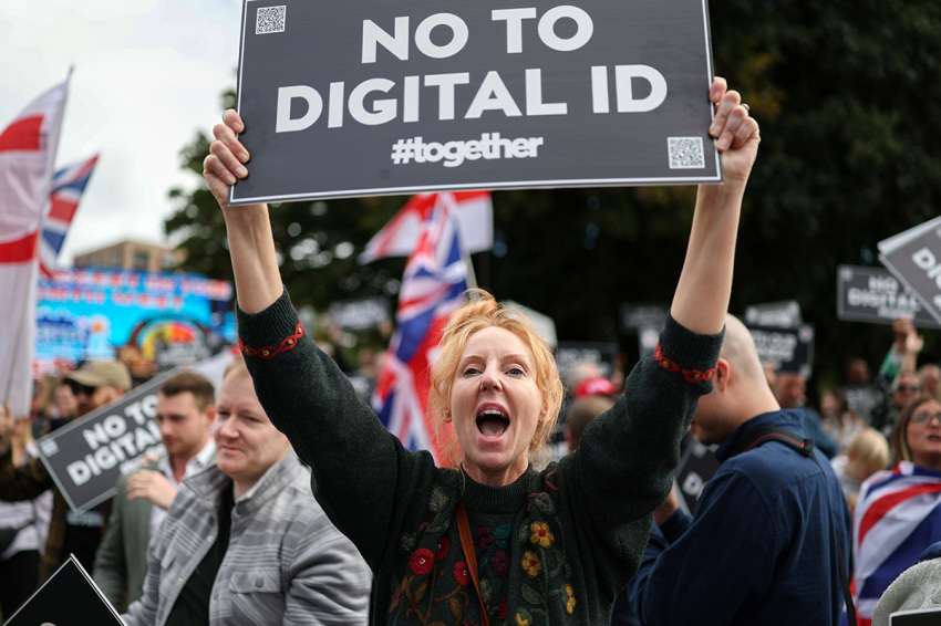 A demonstrator protests against the Labour government's plans to introduce a Digital ID, outside of the Labour Party's conference in Liverpool on Sept. 28, 2025, in Liverpool, England. Labour Conference is being held against a vastly different backdrop to last year when the party had swept to power in a landslide general election victory. A year on and polling shows three quarters of Britons (74-77%) say they have little to no trust in the party on the cost of living, immigration, taxation, managing the economy, representing people like them, or keeping its promises 