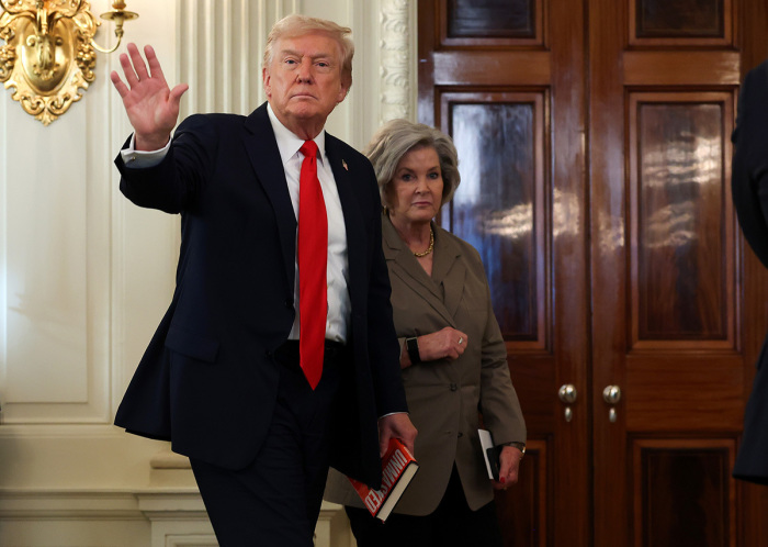 U.S. President Donald Trump departs with White House Chief of Staff Susie Wiles following a roundtable discussion in the State Dining Room of the White House on Oct. 08, 2025, in Washington, D.C. Trump’s administration held the roundtable to discuss the brutal violence committed by Antifa activists after signing an executive order designating it as a “domestic terrorist organization.”
