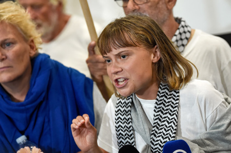 Swedish activist Greta Thunberg speaks as she arrives at Eleftherios Venizelos International Airport on Oct. 6, 2025, in Athens, Greece. Around 450 international activists from the Global Sumud Flotilla were detained last week, as Israeli forces seized several ships bound for Gaza.