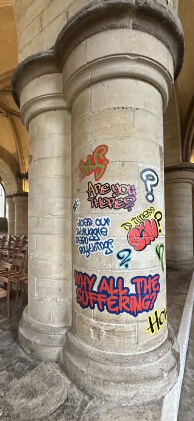 Other graffiti asks, "Are you there?" "Does our struggle mean anything?" and "Why all the suffering?"