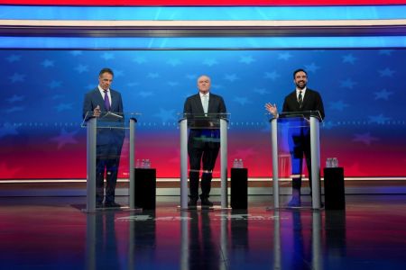 Democratic nominee Zohran Mamdani (R) speaks alongside Independent nominee former New York Gov. Andrew Cuomo (L) and Republican nominee Curtis Sliwa during a mayoral debate at Rockefeller Center on Oct. 16, 2025, in New York City. The candidates for New York City mayor are facing off in their first debate ahead of the November 4 election.