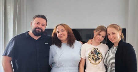 Daniel and Bianca Samson pose for a photo with their two daughters. 