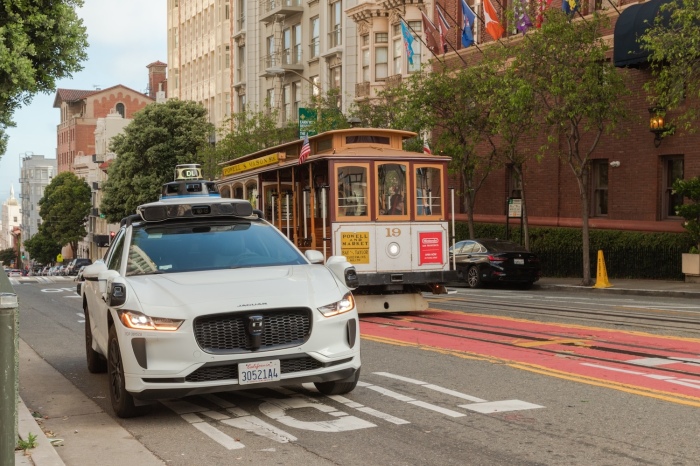 Timeless streetcars and self-driving Waymo cars share San Francisco's roads.