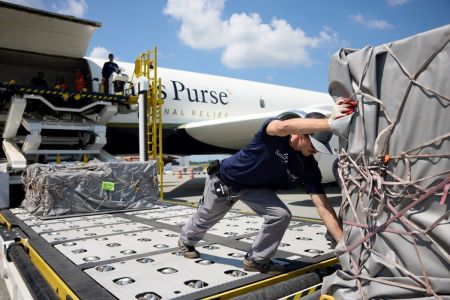 A worker with Samaritan's Purse unloads relief supplies to aid the people of Gaza.