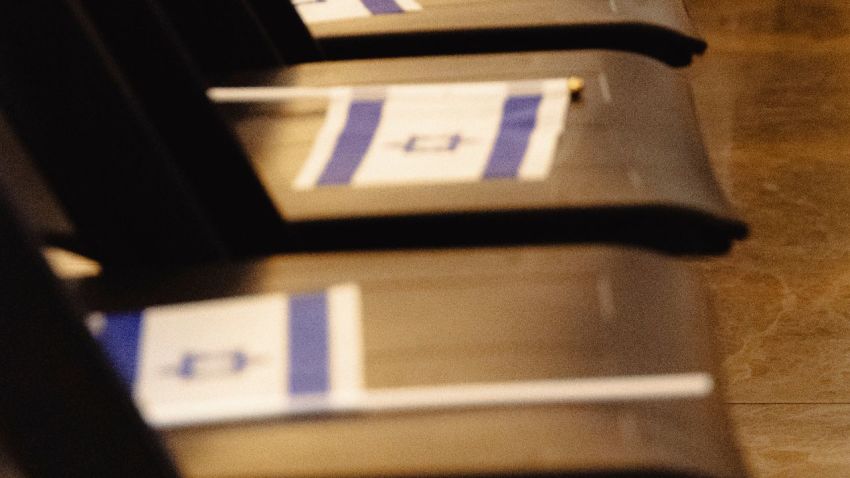 Israeli flags on top of chairs set up for an event at the Catholic University of America in Washington, D.C., on Oct. 20, 2025, featuring IDF soldiers Ron Feingold and Chanoch Berman.