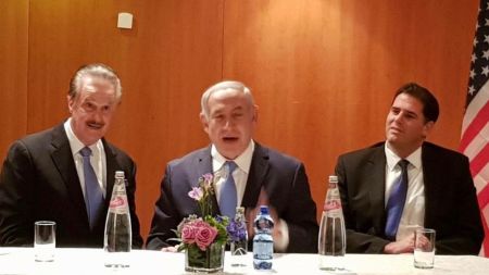 Friends of Zion Founder Mike Evans (L) seated next to Israeli Prime Minister Benjamin Netanyahu (C).