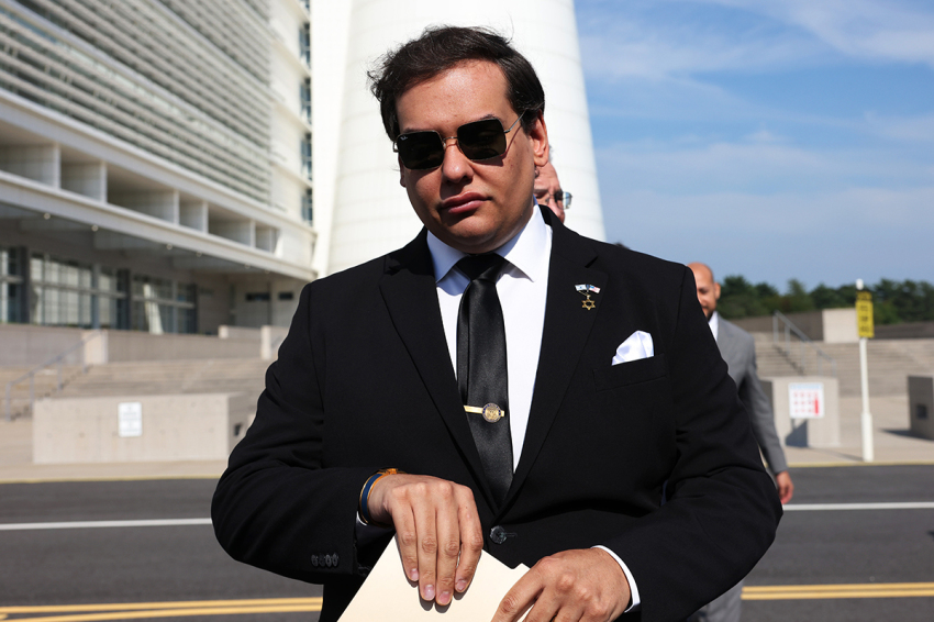 Former U.S. Rep. George Santos prepares to give a statement after a court hearing on Aug. 19, 2024, in West Islip, New York. 