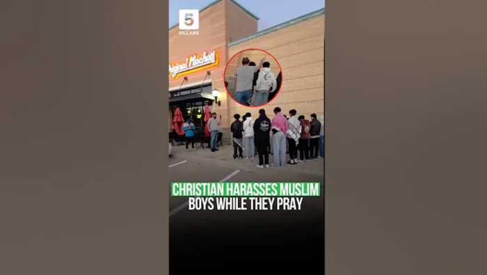 A screenshot of a video showing a group of Muslim teens praying in public in Murphy, Texas.