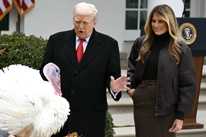 First Lady Melania Trump looks on as U.S. President Donald Trump pardons Gobble, one of the National Thanksgiving turkeys, during the White House turkey pardon ceremony in the Rose Garden of the White House in Washington, D.C., on Nov. 25, 2025. 