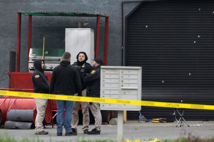 Law enforcement responds to the scene of a shooting on November 30, 2025 in Stockton, California. A suspect is still at large after four people were killed and 11 were wounded in a shooting during a family gathering at a banquet hall. 