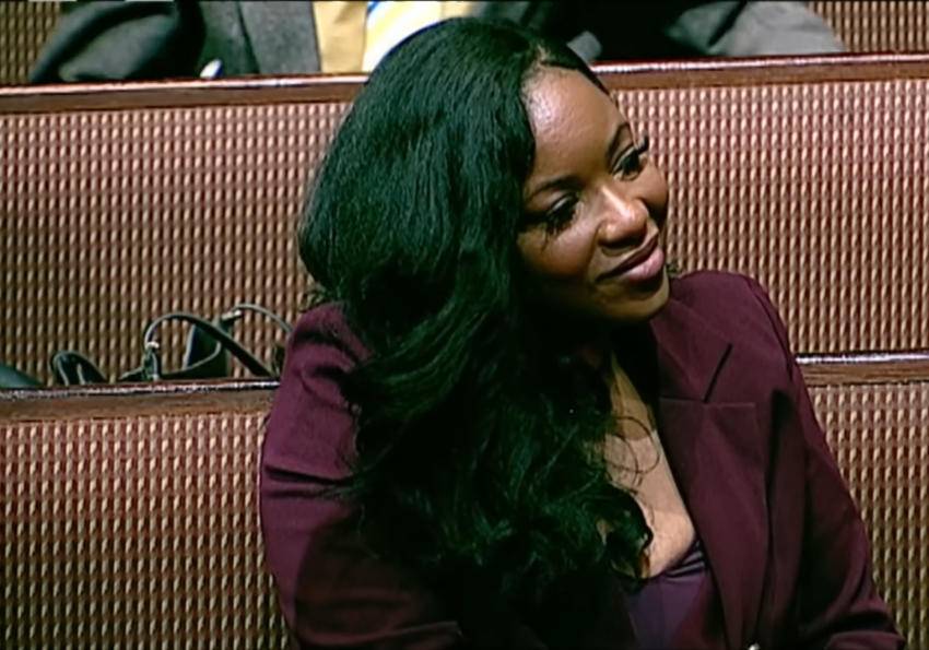 Rep. Jasmine Crockett, D-Texas, smiles as her pastor, the Rev. Frederick Douglass Haynes III, acknowledged her during a worship service at Friendship-West Baptist Church in Dallas, Texas, on Sunday, December 7, 2025.