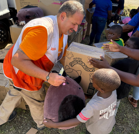 World Vision partnered with Operation Blessing and WaterStep to distribute food kits, disinfectant, and toys in Chester Castle, Jamaica, to help children and families recovering from Hurricane Melissa.