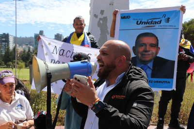 A Venezuelan man living in Ecuador uses a megaphone as he celebrates during a gathering in Quito on Jan. 3, 2026, after U.S. forces captured Venezuelan leader Nicolas Maduro. President Donald Trump said Saturday that U.S. forces had captured Venezuela's leader Nicolas Maduro after bombing the capital Caracas and other cities in a dramatic climax to a months-long standoff between Trump and his Venezuelan arch-foe. 