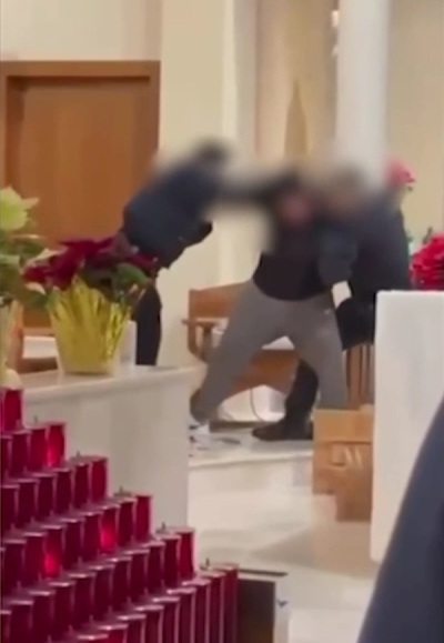 Police fight with a disruptive man at St. Ann Catholic Church of New York, New York, at a Friday morning mass held in January 2026.
