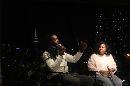 Sharifa Stevens, writer, poet and theologian (R) listens intently as fellow theologian and author Adam Thomason (L) speaks during a discussion of mutual friend, Christian hip-hop artist Lecrae's new book,