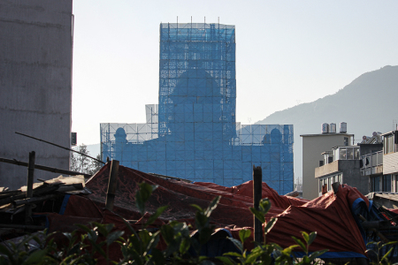 The Yayang church is seen covered in scaffolding in Yayang township, Wenzhou city, in eastern China's Zhejiang province on Jan. 9, 2026. A church in east China was scaffolded and had its cross removed, AFP reporters saw Jan. 9, with residents and rights groups saying multiple church members had been arrested as a national crackdown on unofficial Christian organizations grows. 