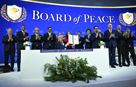 Paraguay's President Santiago Pena (2L), Pakistan's Prime Minister Shehbaz Sharif (5L), Kosovo's President Vjosa Osmani (C-R), Argentina's President Javier Milei (5R), Armenia's Prime Minister Nikol Pashinyan (4R), Bulgaria's former Prime Minister Rosen Zhelyazkov ((3R), Azerbaijan's President Ilham Aliyev (2R) and Hungary's Prime Minister Viktor Orban (R) applaud as U.S. President Donald Trump (C) holds a signing founding charter at the 