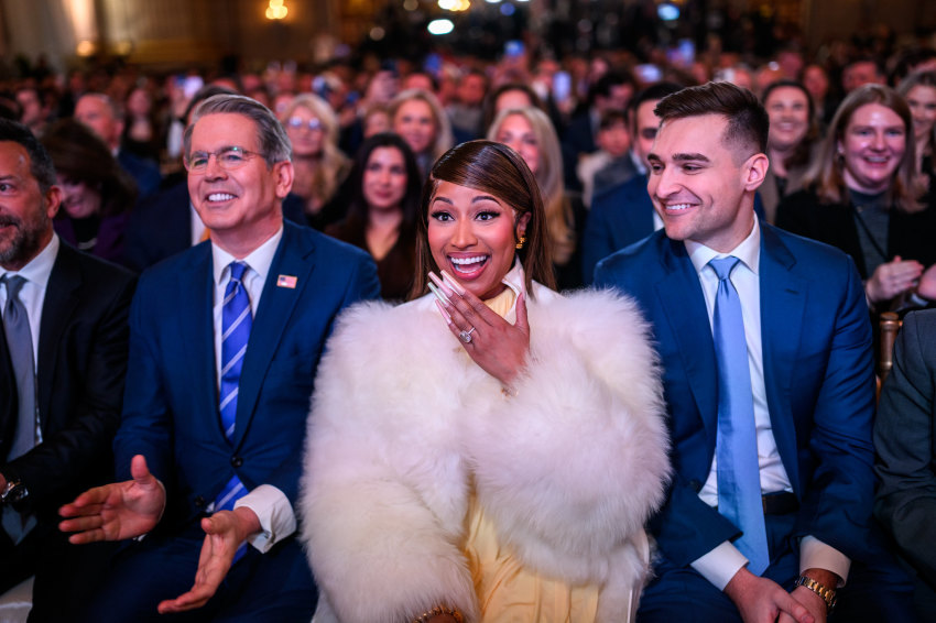 Secretary of Treasury Scott Bessent, Nicki Minaj, and Alex Bruesewitz react as President Donald Trump delivers remarks on Trump Accounts at the Andrew W. Mellon Auditorium in Washington, D.C., on Jan. 28, 2026. 