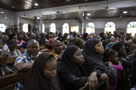 Christians watch a re-enactment of the crucifixion of Jesus Christ during a Good Friday procession in St. Robert Church in Yaba, Lagos, Nigeria, on April 3, 2026.