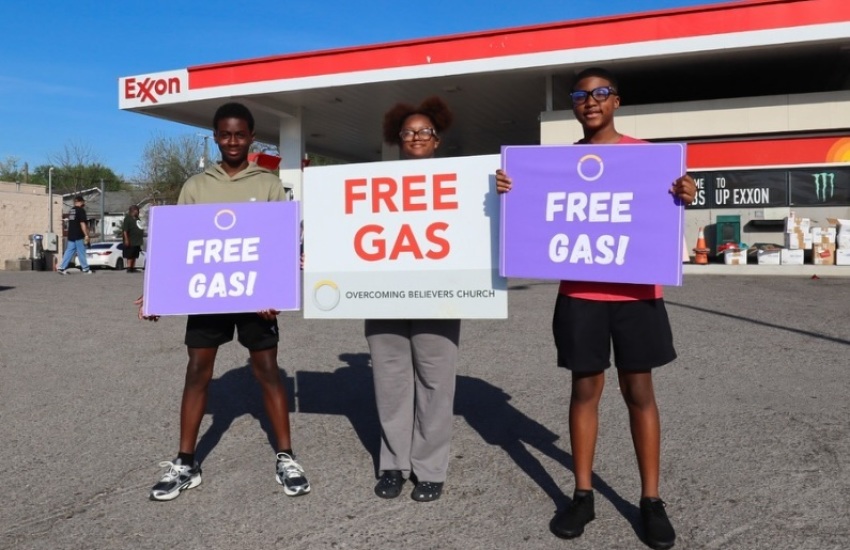 Volunteers with Overcoming Believers Church of Knoxville, Tennessee, provide free gas to commuters as part of their "Gas & Glory" charity event on Saturday, April 4, 2026.