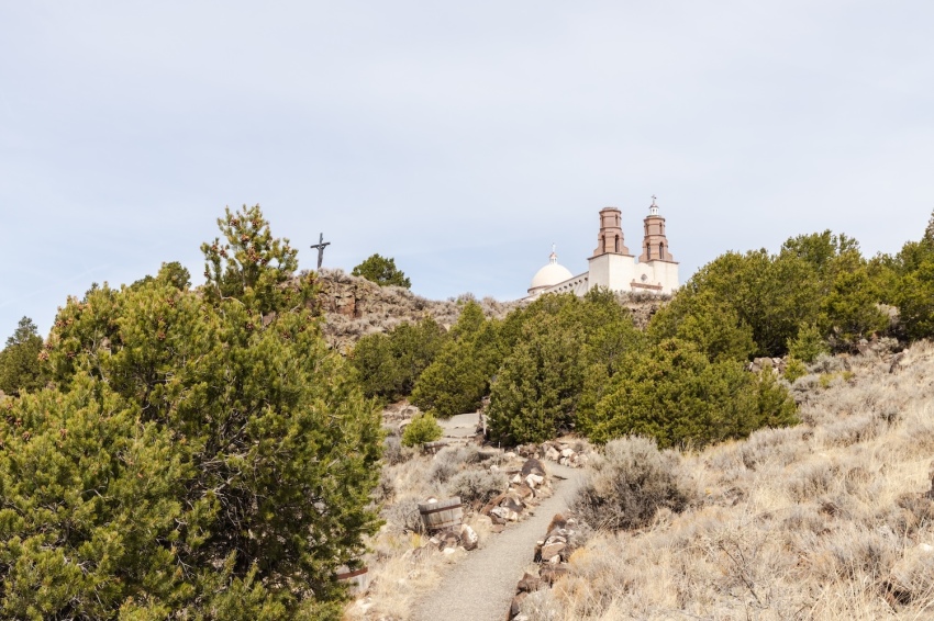 A hiking trail with 15 stations, each marked by a bronze sculpture depicting the judgment, suffering, death and resurrection of Jesus Christ, leads to the Chapel of All Saints in San Luis, Colorado.