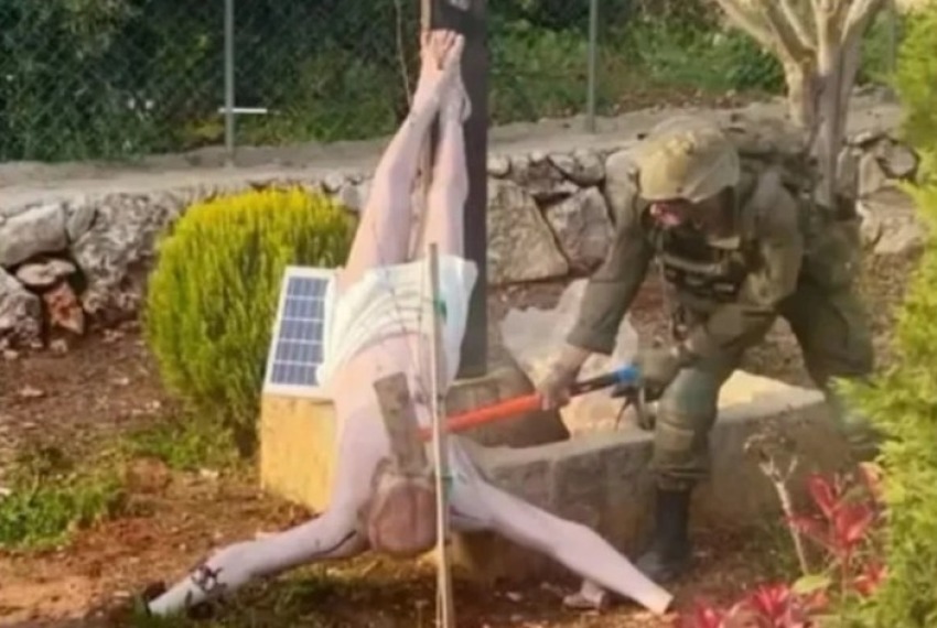 IDF soldier in Lebanon breaking statue, April 20, 2026.
