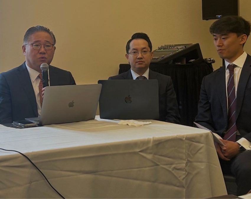 North Korean defector Hyun-Seung Lee (middle) participates in a panel discussion during the 