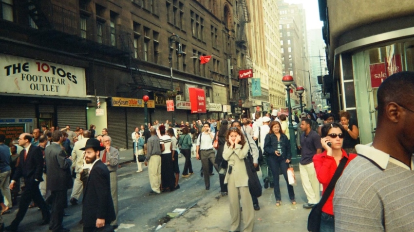 A photo taken by Deane and his roommate shows people looking on with horror after planes struck the World Trade Center on Sept. 11, 2001.