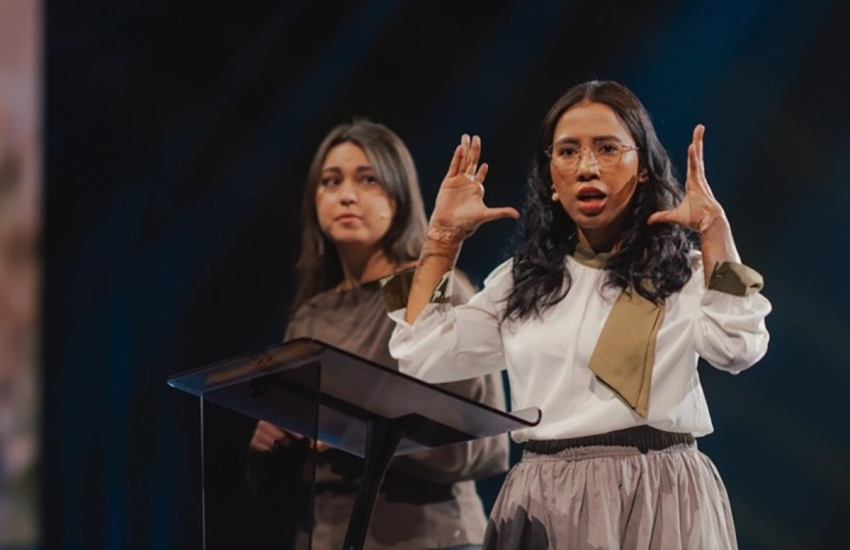 Vina, an Indonesian survivor of a 2021 church bombing, addresses roughly 9,000 attendees at the Open Doors Days gathering in Karlsruhe, Germany.