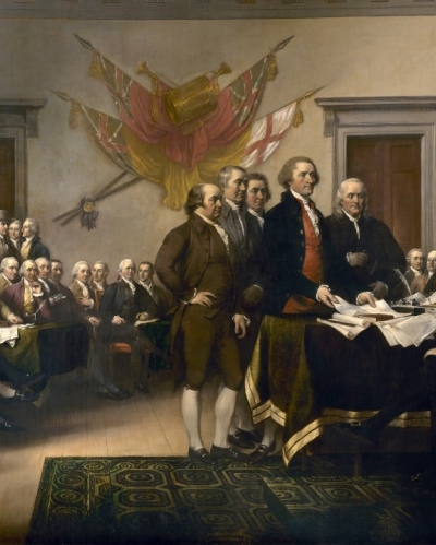 John Trumbull's famous 1819 painting, which hangs in the rotunda of the U.S. Capitol, depicts the five-man drafting committee of the Declaration of Independence presenting their work to the Congress. Charles Carroll of Carrollton is shown seated in the back row, looking behind him.