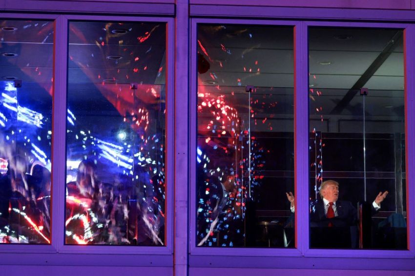 U.S. President Donald Trump watches fireworks from inside a building during the Salute to America Celebration on the National Mall on July 04, 2026 in Washington, DC.