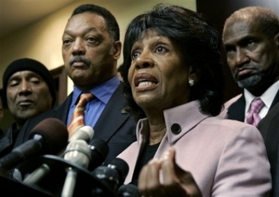 The Rev. Jesse Jackson, second from left, comedian Paul Mooney, left, and Willis Edwards, right, a member of the national board with the NAACP, listen in as U.S. Rep. Maxine Waters, D-Los Angeles, speaks during a news conference Monday, Nov. 27, 2006, in Los Angeles, regarding comedian Michael Richards' recent tirade at a Los Angeles comedy club.