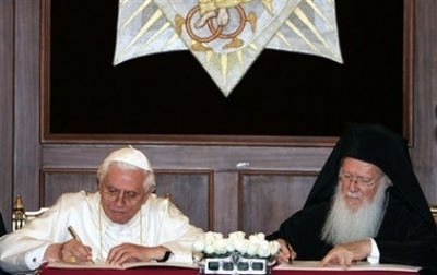 Pope Benedict XVI, left, and Ecumenical Orthodox Patriarch Bartholomew I, sign a joint declaration in the Patriarchal Church of St. George, in Istanbul, Turkey, Thursday, Nov. 30, 2006. The pope is in Turkey on a four-day visit.