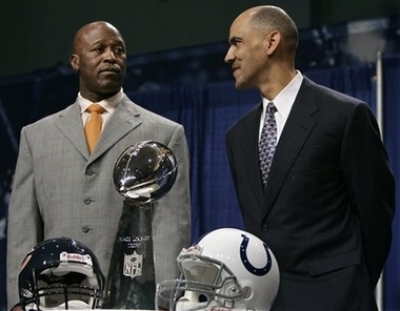 Indianapolis Colts coach Tony Dungy, right, and Chicago coach Lovie Smith pose with the Vince Lombardi Super Bowl trophy during their press conference at the Miami Beach Convention Center in Miami Beach, Fla., Friday, Feb. 2, 2007. The Indianapolis Colts will play the Chicago Bears in Super Bowl XLI on Feb. 4.