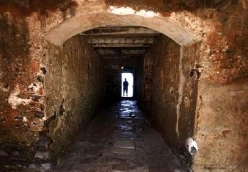 A man is silhouetted against the ''Door of No Return'' at the House of Slaves on Goree Island near Senegal's capital Dakar March 16, 2007. Millions of Africans were shipped from places like this whitewashed fort in Elmina, Ghana, to a life of slavery in Brazil, the Caribbean and America. The world will mark the bicentenary of the end of the Atlantic slave trade on March 25.