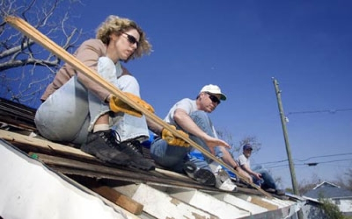 A Volunteers in Mission team from Christ Church United Methodist in New York repairs a roof damaged by winds from Hurricane Katrina in Biloxi, Miss.