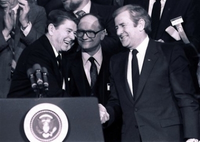 President Reagan shakes hands with The Rev. Jerry Falwell Sr., right, during a convention of National Religious Broadcasters in this Jan. 30, 1984, file photo in Washington, D.C. Falwell, the folksy, small-town preacher who used the power of television to found the Moral Majority and turn the Christian right into a mighty force in American politics during the Reagan years, died Tuesday, May 15, 2007. He was 73. 