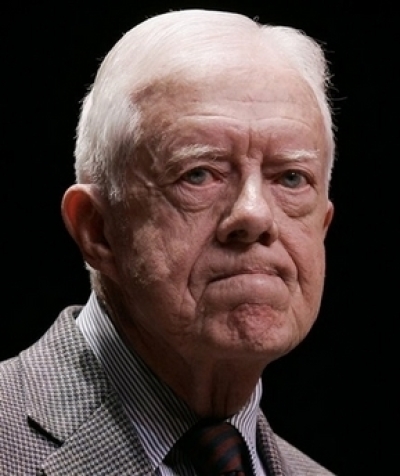 Former President Jimmy Carter listens to a student's question after speaking about his book 'Palestine: Peace not Apartheid,' in this March 8, 2007 file photo at George Washington University in Washington. 