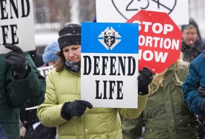 Jean Osborne, left, braves sub-zero temperatures while marching with more than 350 abortion protesters through downtown Montpelier, Vt., Saturday, Jan. 27, 2007, to the Statehouse in marking the anniversary of the 1973 Roe v. Wade ruling. 
