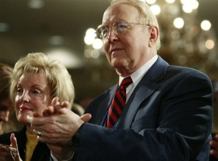 Christian evangelical leader James Dobson, right, and his wife Shirley, stand and applaud as President Bush, not pictured, addresses the National Religious Broadcasters 2008 Convention, Tuesday, March 11, 2008, at the Gaylord Opryland Resort and Convention Center in Nashville, Tenn.