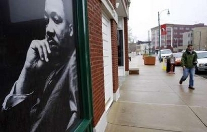 A photograph of the Rev. Dr. Martin Luther King hangs in a window in downtown Memphis, Tennessee, April 3, 2008.