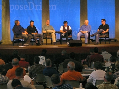 Saddleback Church Pastor Rick Warren, left, participates in a panel discussion with other influential church leaders at the Purpose Driven Summit on May 20, 2008.