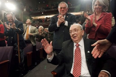 In this Feb. 10, 2005 photo, retired Sen. Jesse Helms, R-N.C., receives applause after being acknowledge by President Bush during his visit to BTI Center for the Performing Arts - Meymandi Concert Hall, in Raleigh, N.C. Helms has died at age 86, the Jesse Helms research center says.