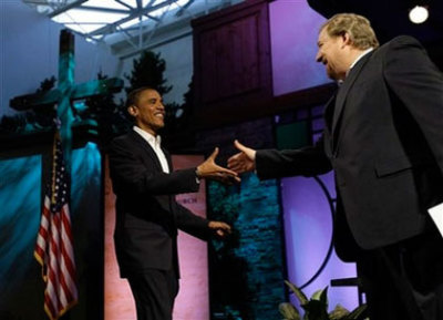 Democratic presidential candidate Sen. Barack Obama, D-Ill., shakes hands with Pastor Rick Warren during the Saddleback Forum in Lake Forrest, Calif. Saturday, Aug. 16, 2008.