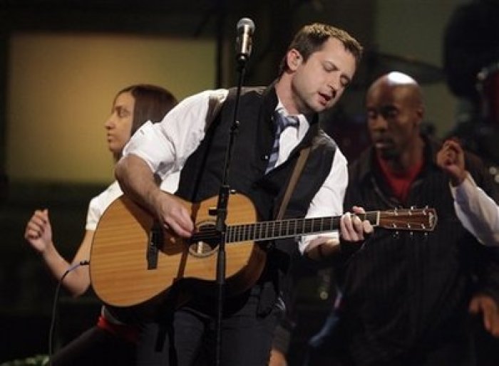 Brandon Heath performs the song 'Give Me Your Eyes' at the Dove awards in Nashville, Tenn., Thursday, April 23, 2009. The song won the award for song of the year. The Dove awards honor Christian and gospel music.