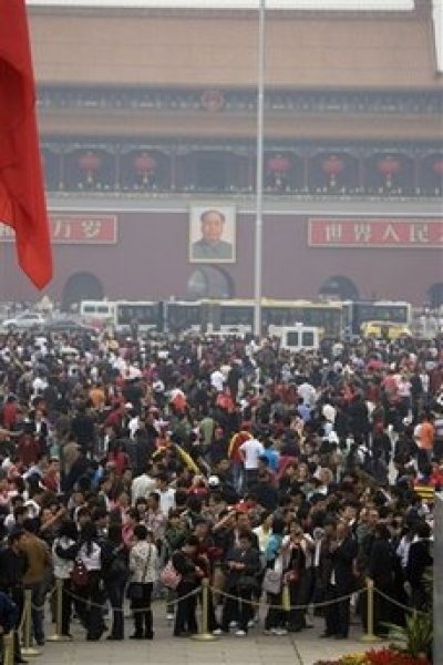 Tens of thousands of visitors crowd Tiananmen Square on the first day of the May holidays in Beijing, China, Friday, May 1, 2009.