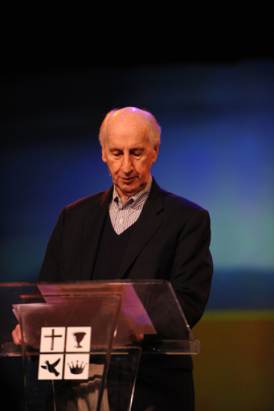 Dr. Jack Hayford makes an announcement at he opening business session of the International Foursquare Church's convention in Anaheim, Calif., Tuesday, May 26.