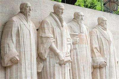 A view of the Reformation Wall with statues of William (Guillaume) Farel, John (Jean) Calvin, Theodore de Beze, and John Knox, from left to right, at Bastion Park in Geneva, Switzerland, Friday, June 19, 2009. 